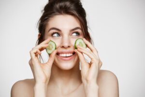 image of a woman with cucumbers on eyes