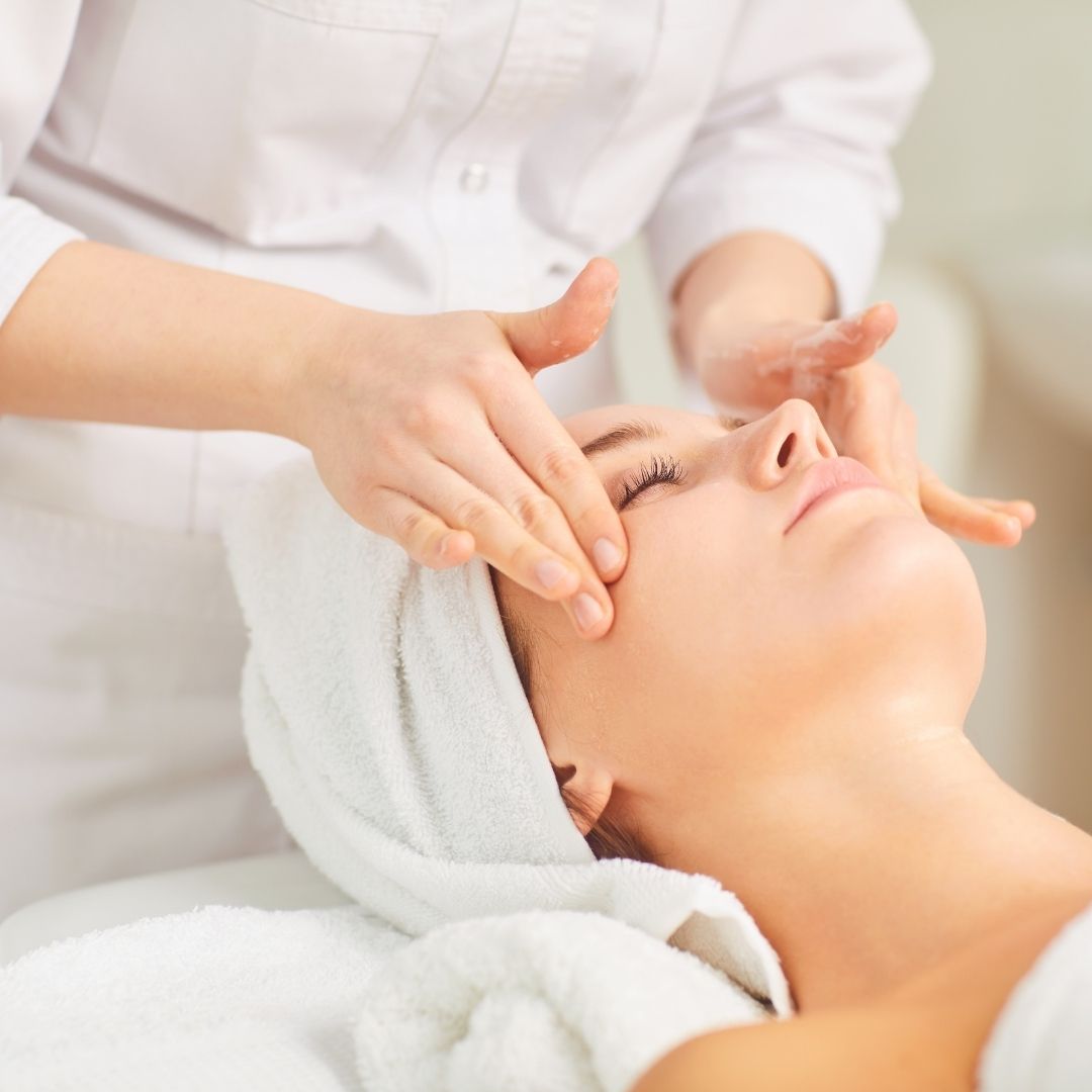 woman having her face massaged