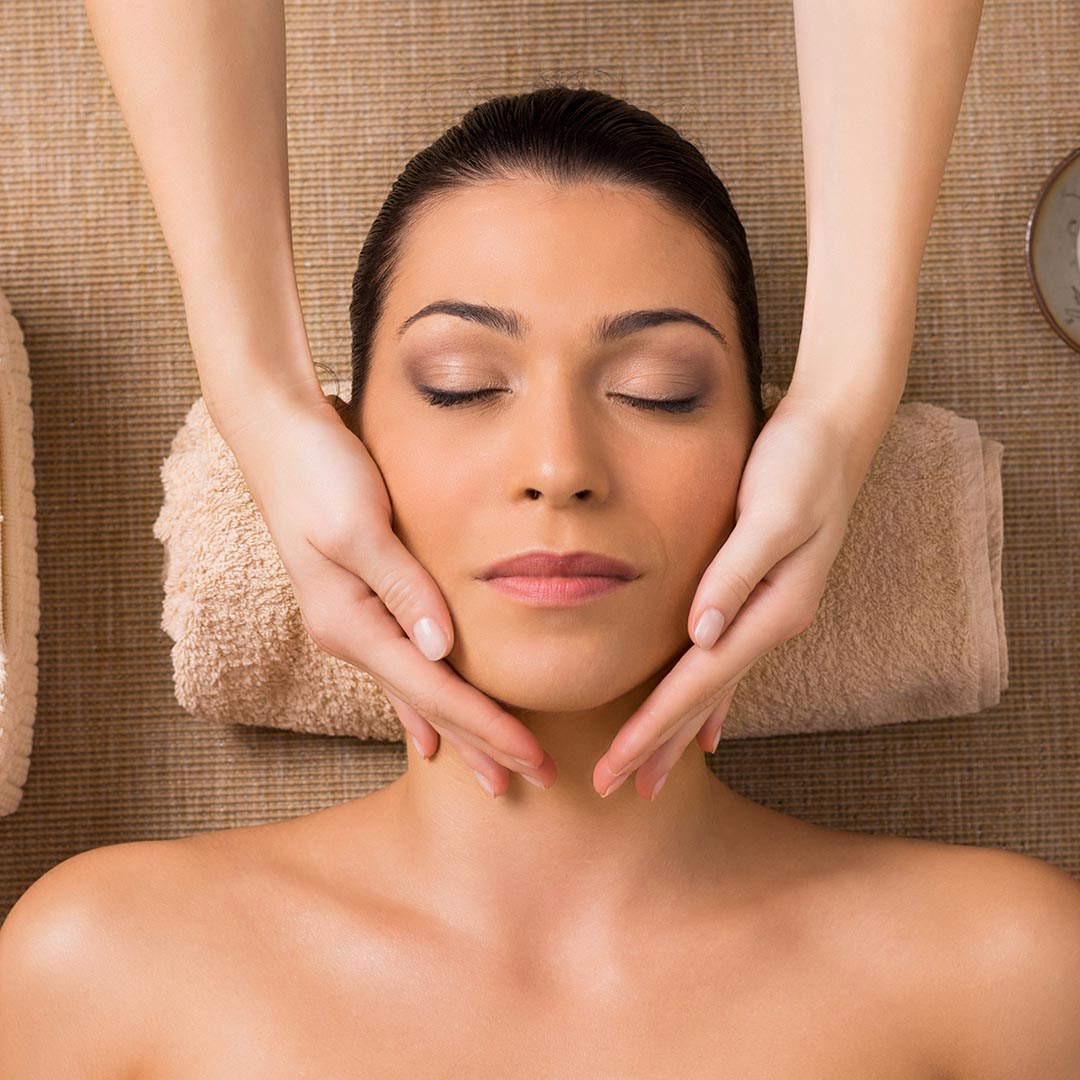 Woman getting her face massaged