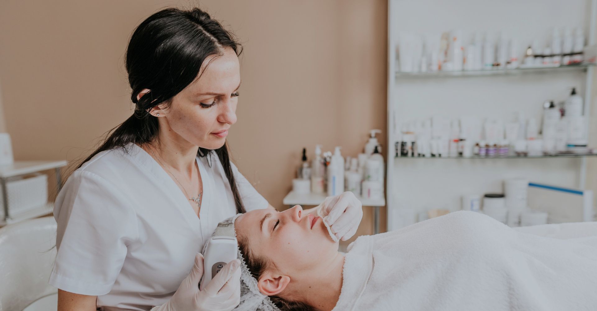An esthetician giving a facial treatment
